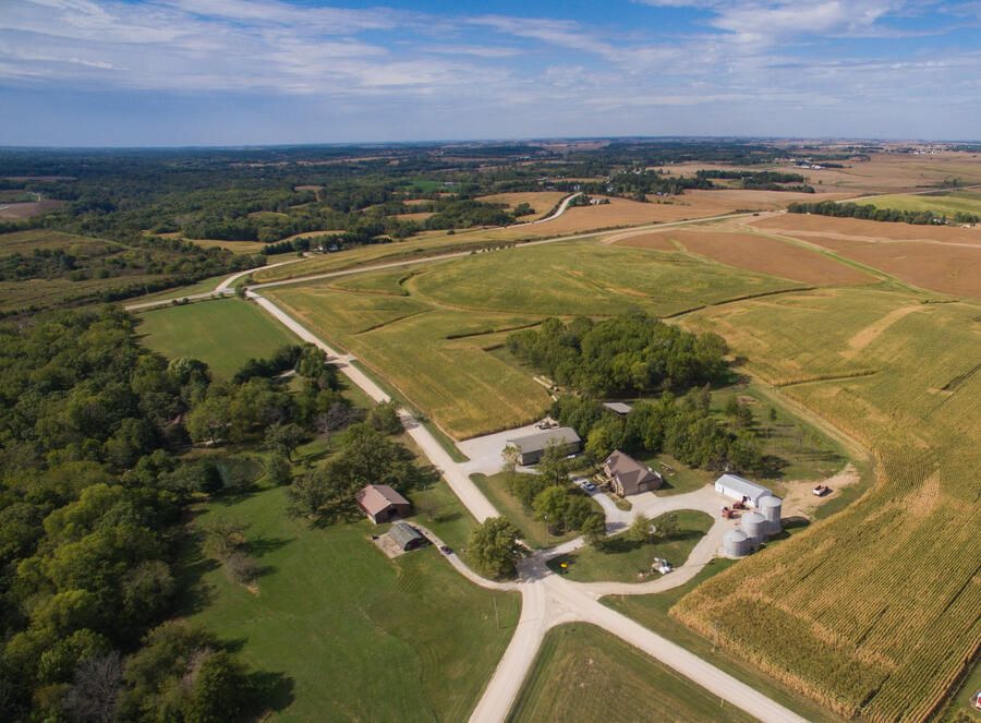 Farm in the country surounded by fields
